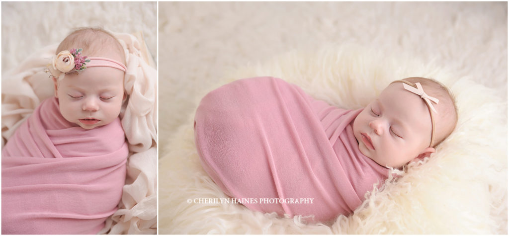 6 week old newborn baby girl swaddled in pink wrap