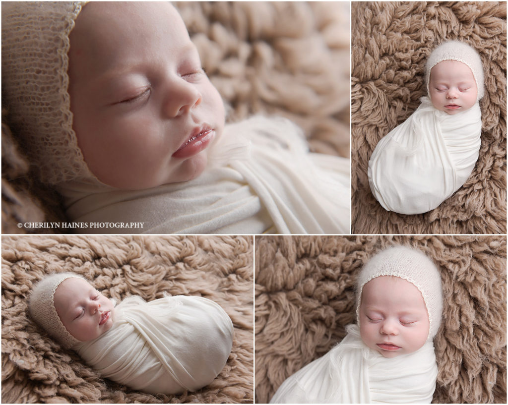 newborn baby girl swaddled in white with a soft knit bonnet