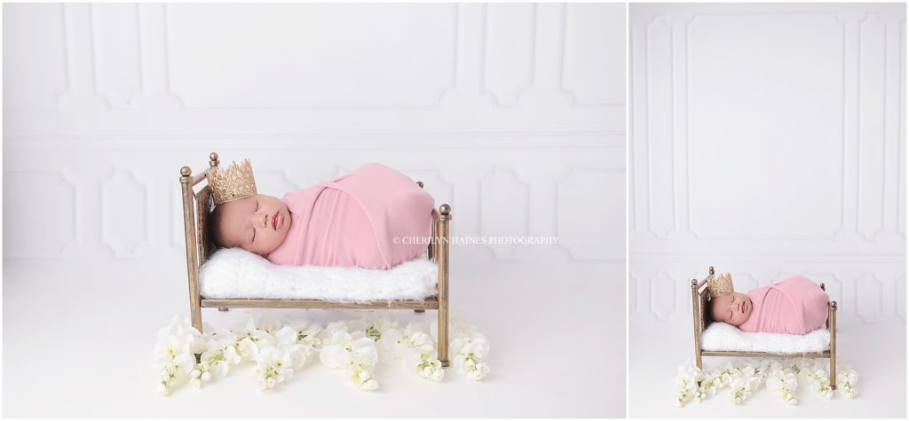 newborn baby girl photographed laying on tiny gold bed wearing a gold tiara