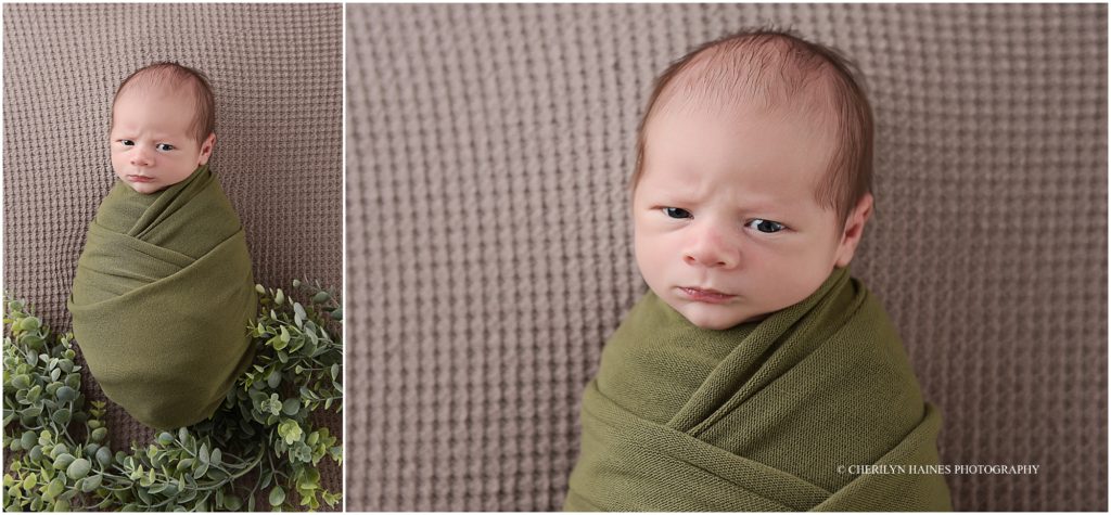 awake newborn with grumpy face