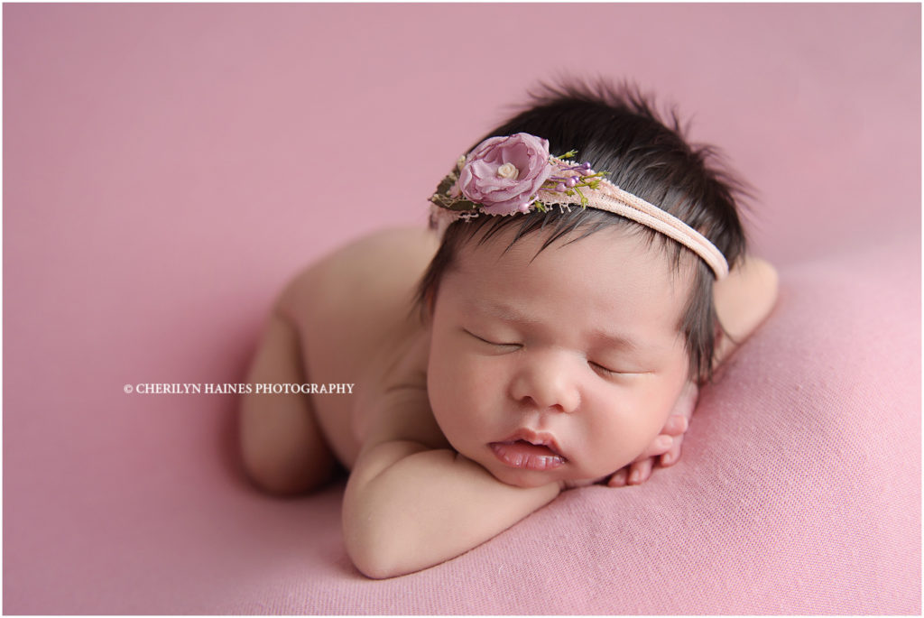 baton rouge, louisiana newborn portrait session ; baby girl photographed on pink blanket