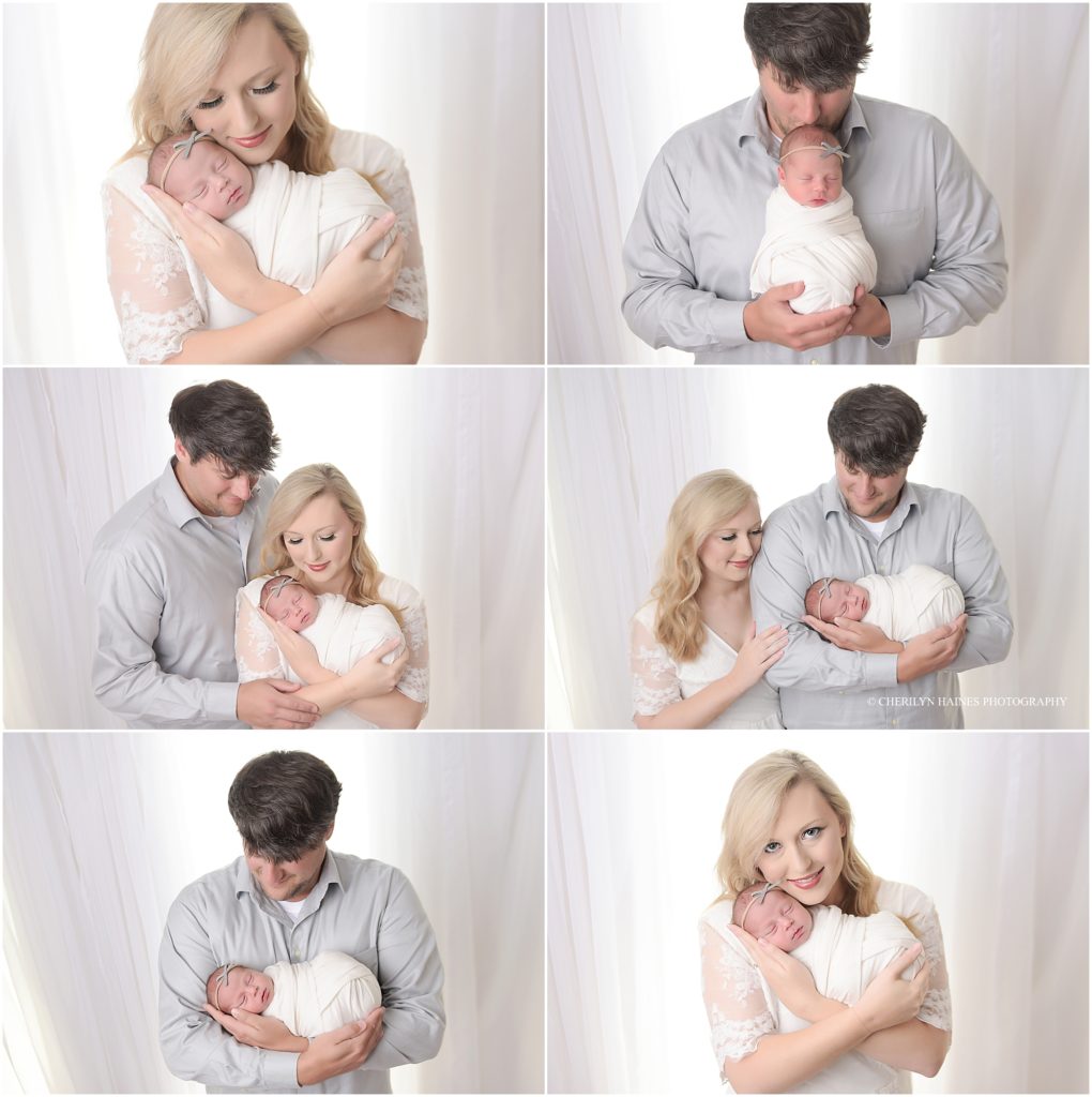 mom and dad photographed with 2 week old newborn baby girl