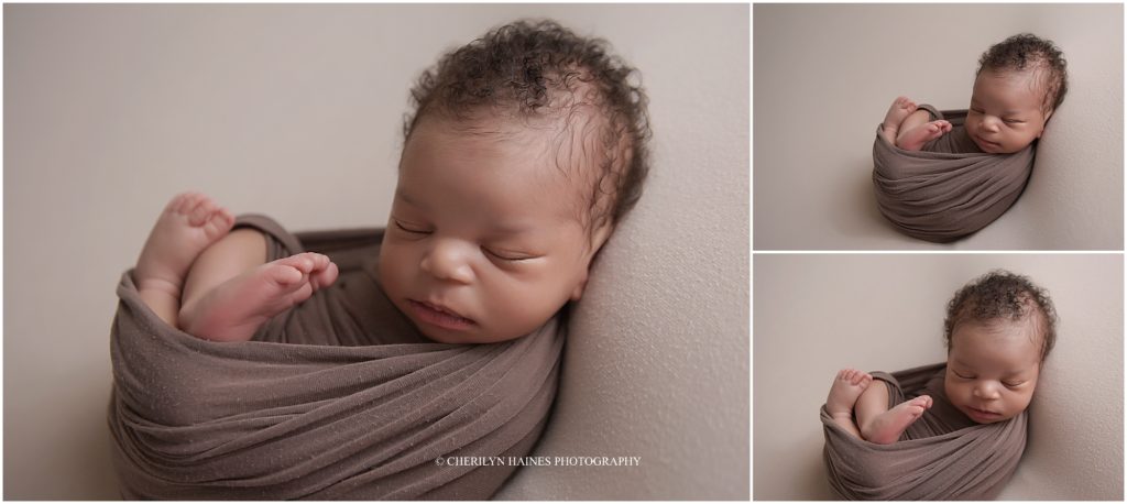 baby boy swaddled in brown swaddled with toes showing