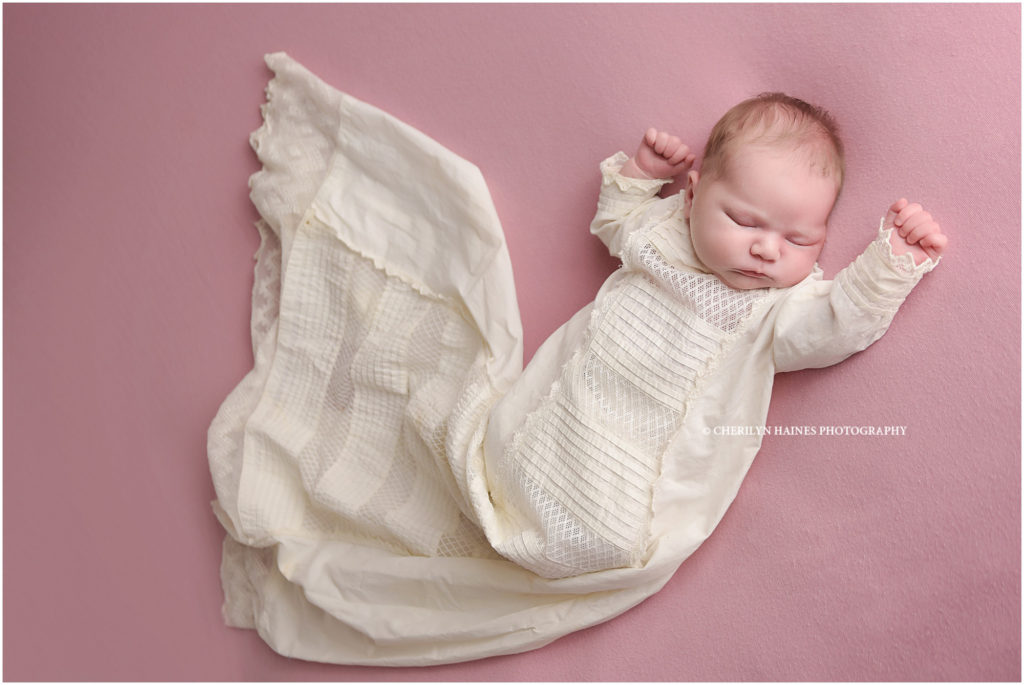newborn portraits in baby's baptismal gown in baton rouge, louisiana