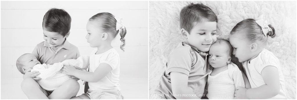 black and white portraits of brother and sister with newborn baby sister