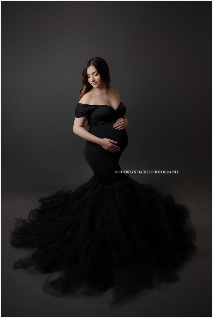 fine art maternity session with Cherilyn Haines Photography in New Orleans, Louisiana; pregnant mom wearing showstopper black dress with large tulle skirt