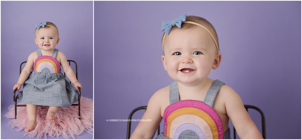 1 year old baby girl wearing pink and purple rainbow dress