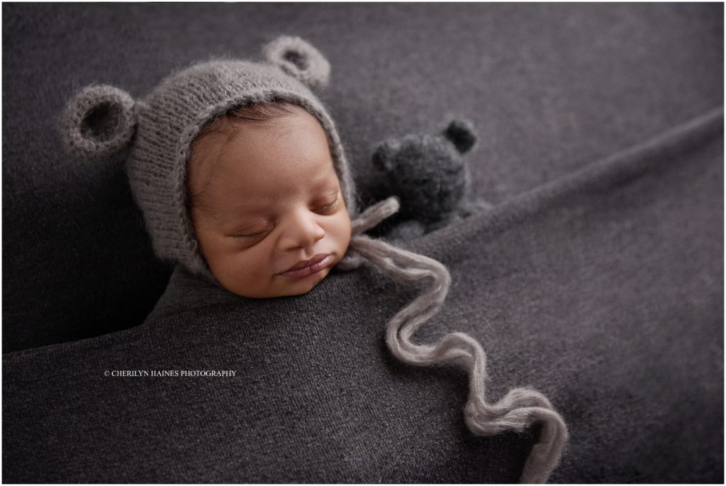 denham springs, louisiana newborn session; baby boy wearing gray bear bonnet
