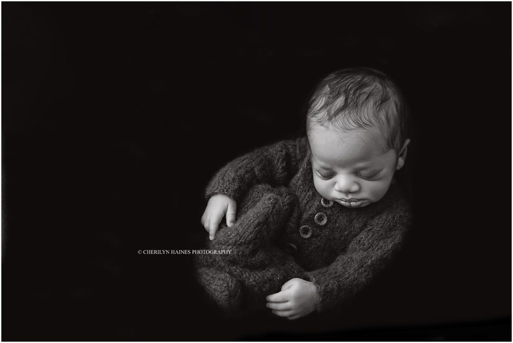 black and white fine art newborn portrait of newborn baby boy in baton rouge, louisiana by cherilyn haines photography
