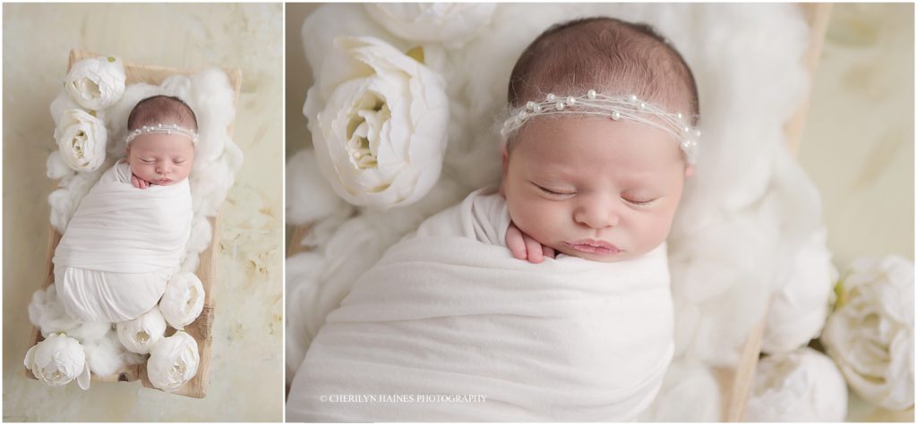 white peony themed newborn portrait setup with one of the best newborn photographers in baton rouge, louisiana