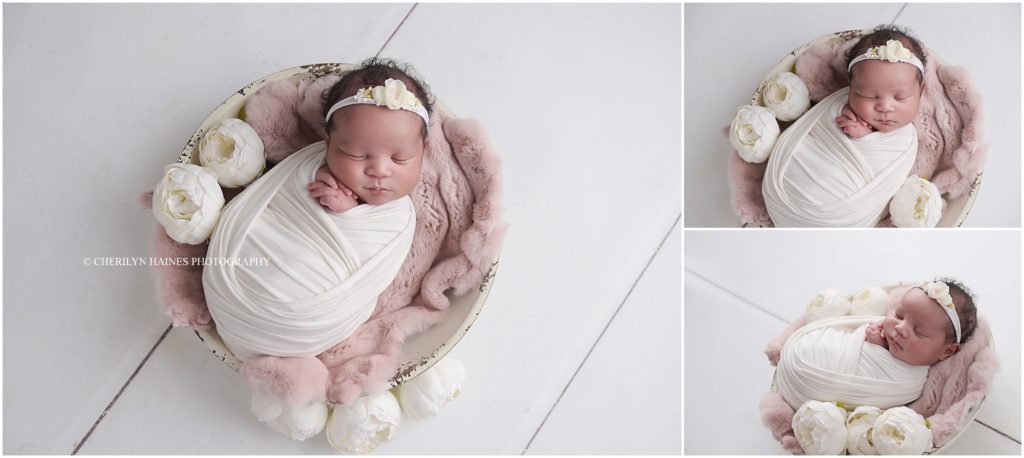 newborn session with baby posed laying in bowl with white peonies