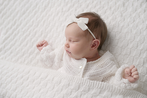 Refined studio newborn portrait in Baton Rouge by a luxury photographer