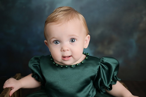 Baby portrait photographed with jewel tones in Baton Rouge studio