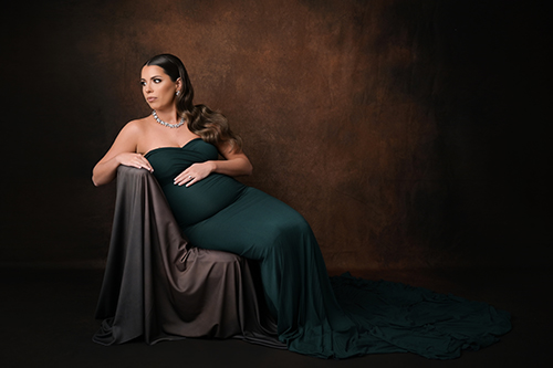 Pregnant mother posing in a black gown during a Baton Rouge studio maternity session