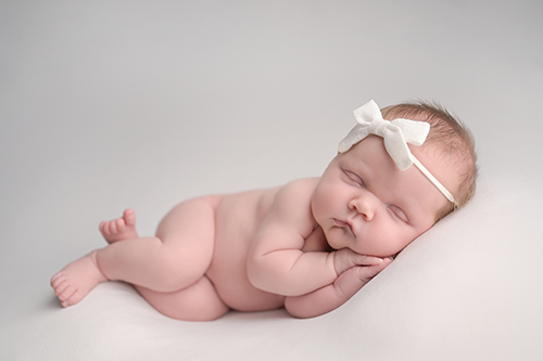 Newborn baby girl portrait taken in Baton Rouge photography studio