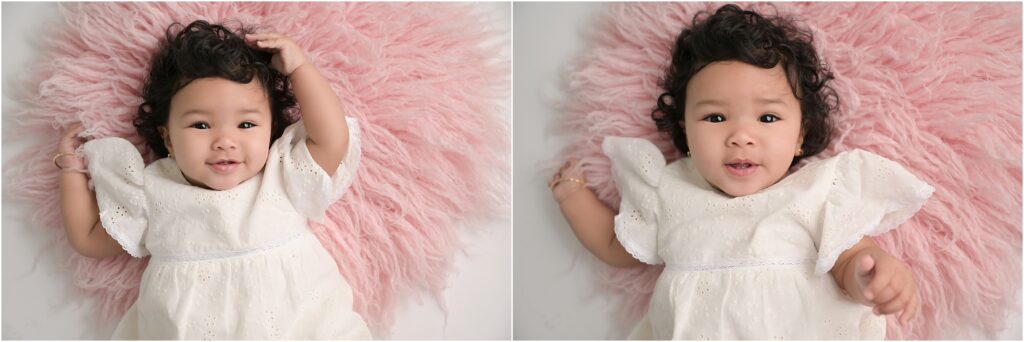 6-month-old baby girl posed on a soft pink rug during a milestone photography session