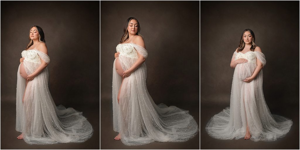 Pregnant mom in a glamorous beaded white maternity gown photographed against a dark brown studio backdrop