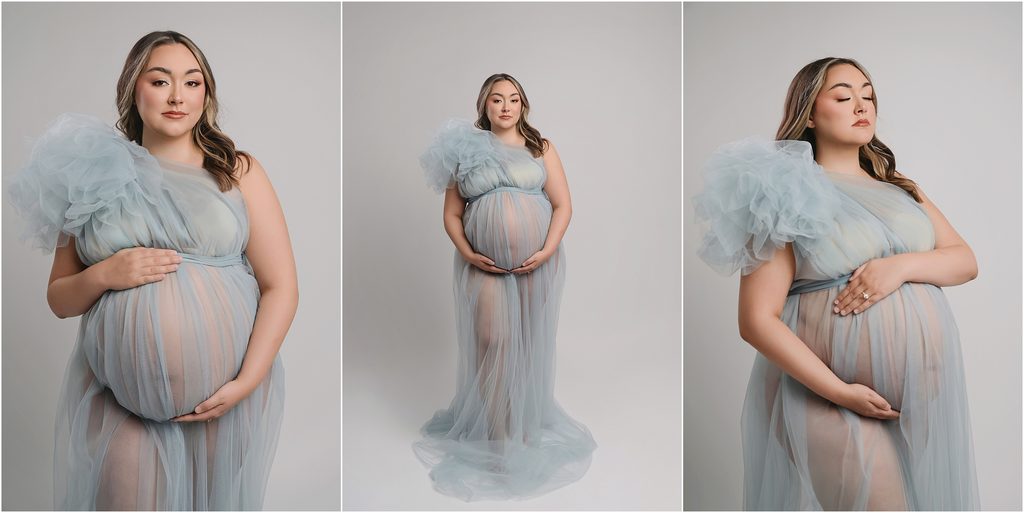 Close-up maternity portrait of pregnant mom wearing a light blue tulle gown with a dramatic one-shoulder sleeve