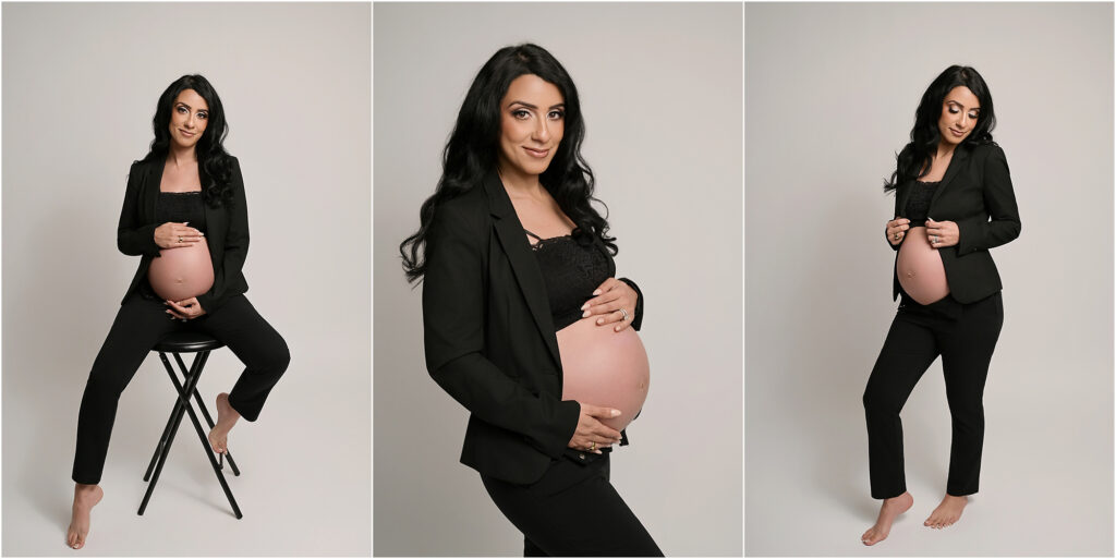 Pregnant woman wearing a sleek black suit with a tube top and her pregnant belly showing during a Baton Rouge maternity