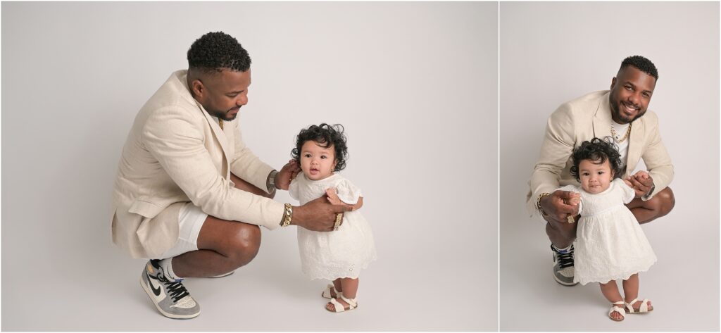 Daddy interacting with 6-month-old baby girl wearing a white dress