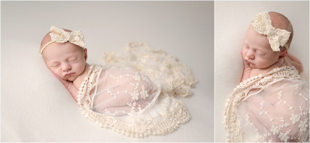 Newborn baby girl sleeping on her tummy covered with an ivory lace blanket