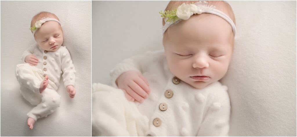 Newborn baby girl peacefully posed on her back wearing a simple white romper