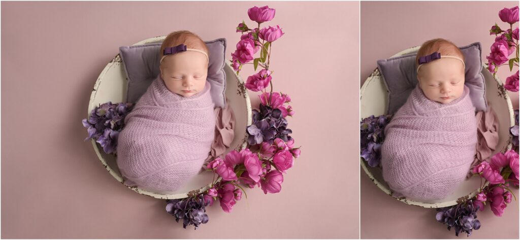Newborn baby girl swaddled in lavender on a purple blanket surrounded by pink and purple flowers