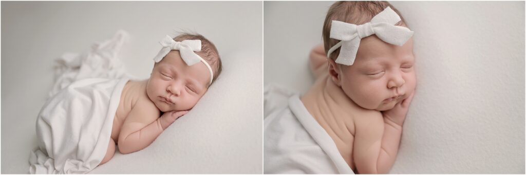 Newborn baby girl sleeping peacefully on her belly on a soft white blanket with a delicate bow